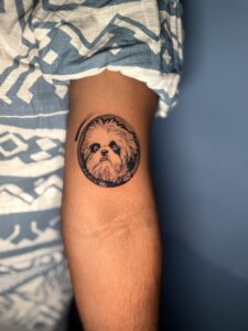 Black and grey tattoo of a dog's portrait on inner forearm — 1920 Tattooz Hub, Ahmedabad