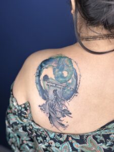 Colored tattoo of a samurai warrior at a torii gate on shoulder blade — 1920 Tattooz Hub, Ahmedabad