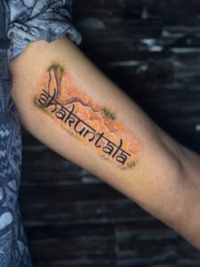 Colored tattoo of the name Shakuntala in Devanagari script on forearm — 1920 Tattooz Hub, Ahmedabad