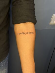 Fine line tattoo of Devanagari script text on forearm — 1920 Tattooz Hub, Ahmedabad