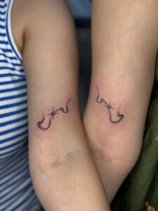 Fine line tattoo of a shooting star on upper arm — 1920 Tattooz Hub, Ahmedabad