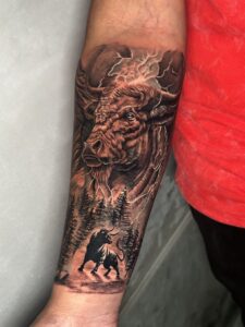 Realistic tattoo of a bison on forearm — 1920 Tattooz Hub, Ahmedabad